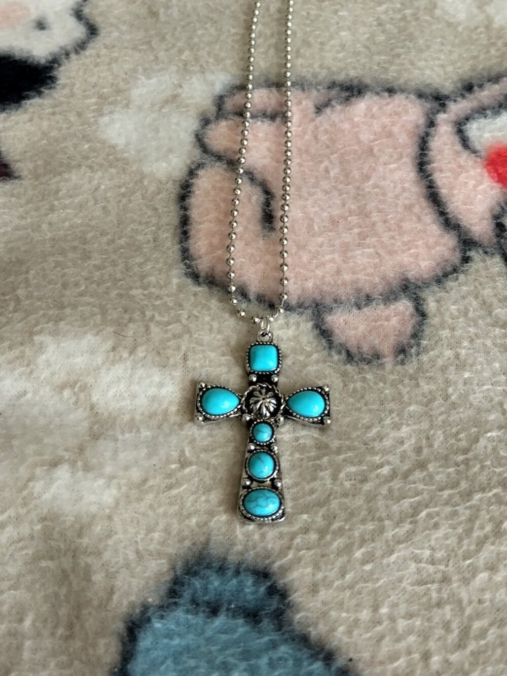 western style blue stone cross on short 16 inch chain